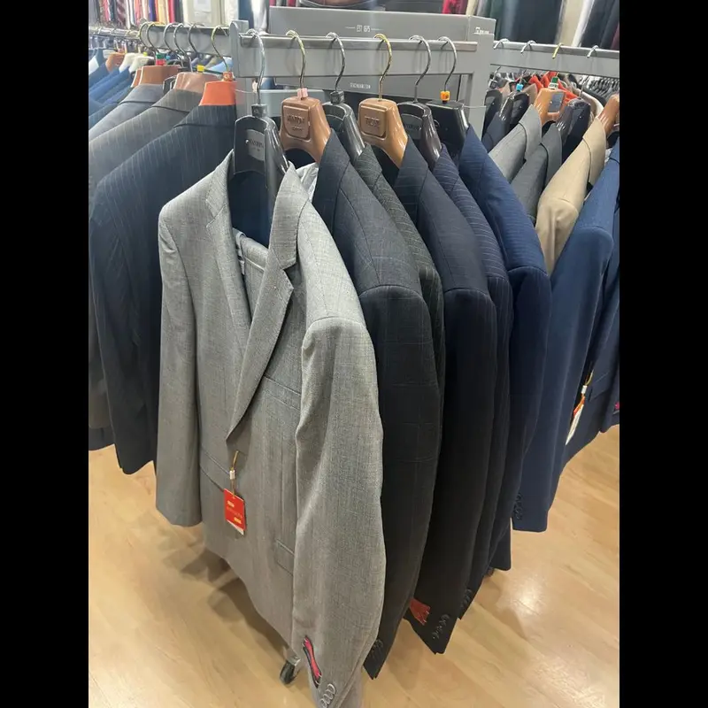 A rail of grey, navy and charcoal suits at Suit Zone, Orange CA