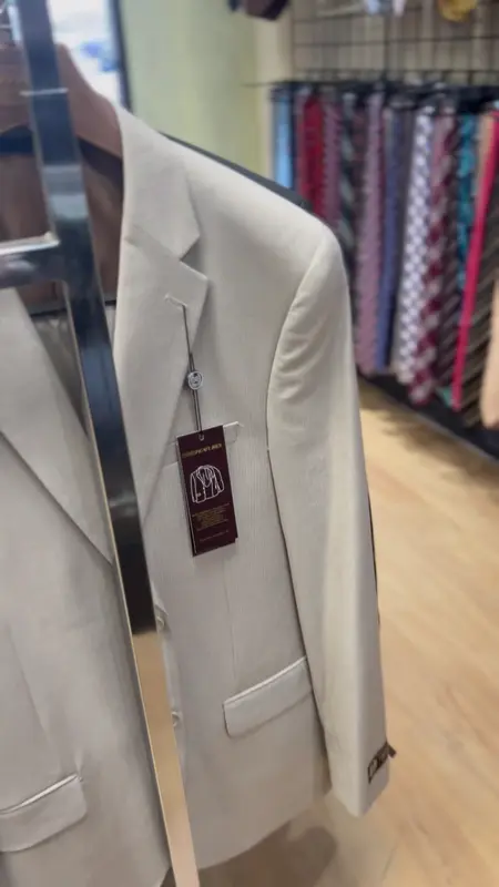 A cream dinner jacket on the rail at Suit Zone